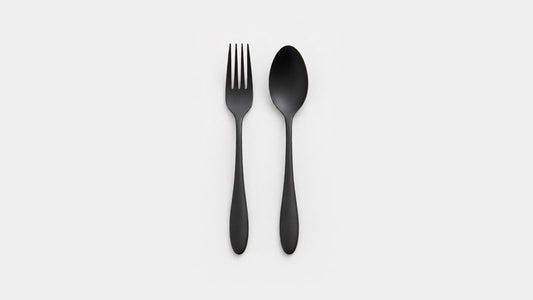 Urushi-finished stainless steel fork and spoon with teardrop handles on a white background