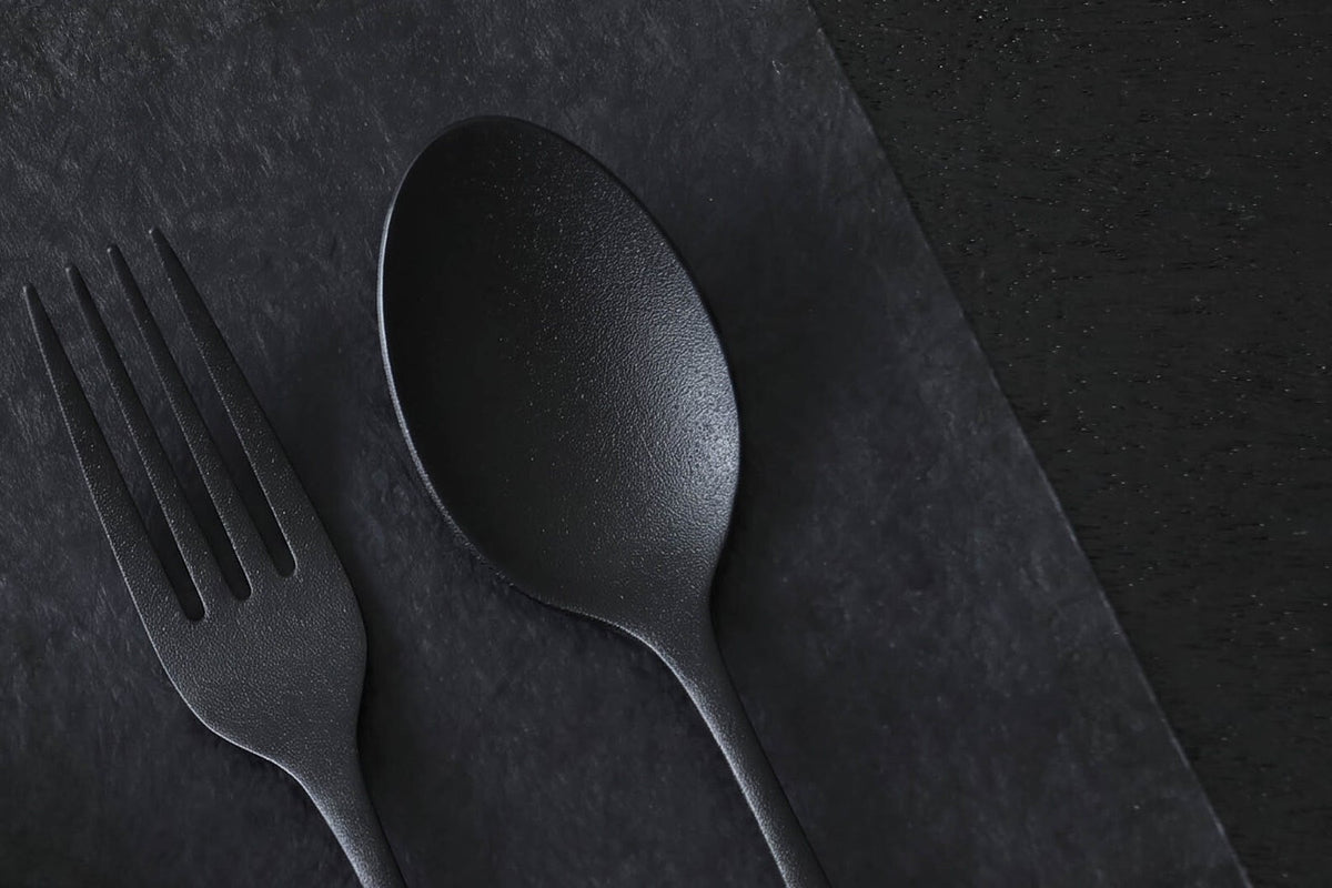 Close-up of the matte urushi texture on THE URUSHI spoon and fork