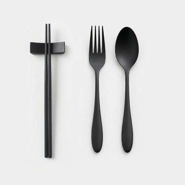 THE URUSHI Full Set on white: chopsticks on their rest, fork and spoon in matte black urushi